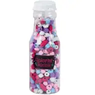 Luna: Bunte auffädelbare Perlen in einem Glasbehälter